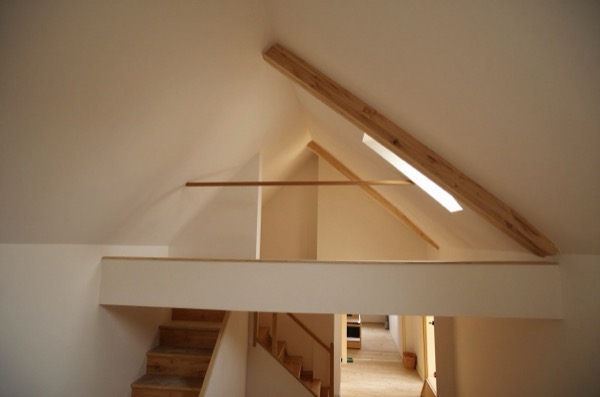 Lower floor view looking up into converted loft.