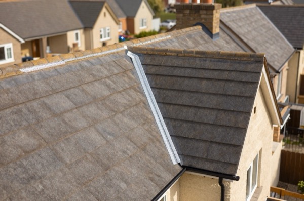 Aerial view of a roof with detailed lead flashing at valleys, abutments, and chimneys.
