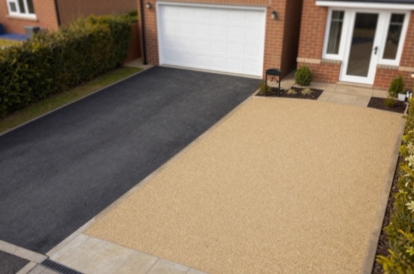 Aerial comparison of tarmac and resin-bound gravel driveways in a suburban setting.
