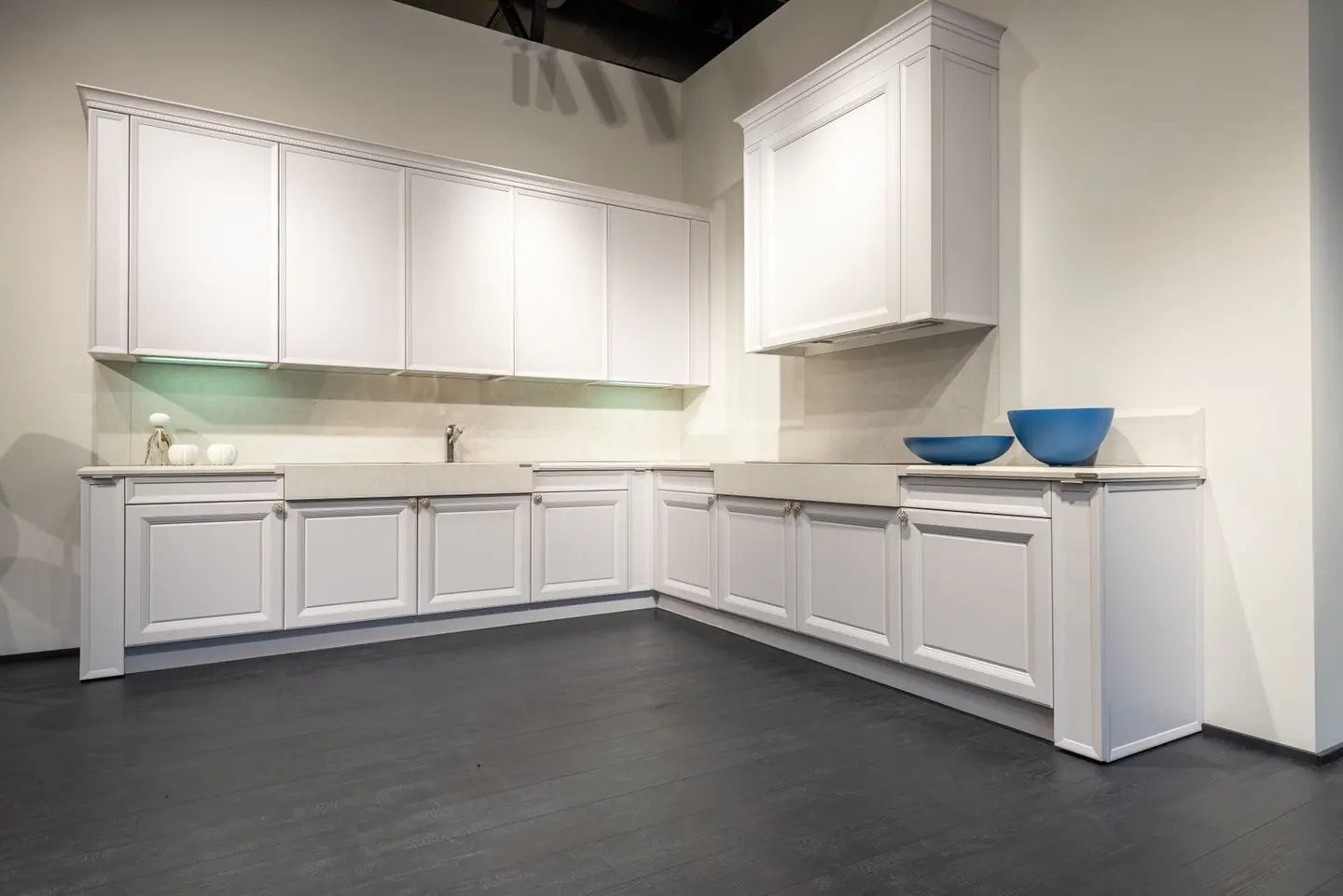 Contemporary interior with new empty units of white colour on black laminate in spacious kitchen