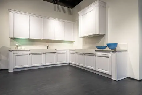 Contemporary interior with new empty units of white colour on black laminate in spacious kitchen
